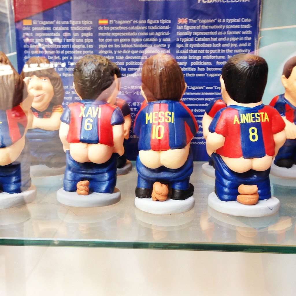 Messi the Caganer. By pooping, or so Catalonians believe, the good omen Caganer fertilises the Earth and thus promises a good harvest in the coming season. The Caganer is also explained as a symbol of equality in that all people, regardless of their background, defecates. Either way, he’s in recent years abandoned his traditional black-banded peasant’s hat and have taken form as famous world figures.