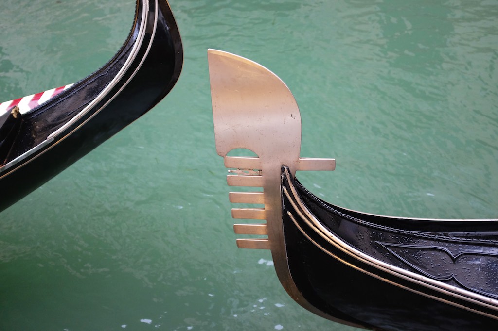 There are two types of gondola in Venice. The one with the blade is the 'newer' 16th century version.